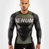 Venum One FC Impact Rashguard - Long Sleeves - Black-Khaki 2 Venum One FC Impact Rashguard - Long Sleeves - Black-Khaki -Training gear shop 413a87c0a2d392c2286978c6e9bca98dcb4eddda RASH LS ONEFC IMPACT BLACK KHAKI 01