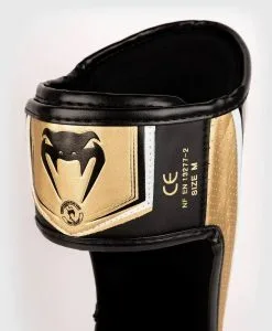 Venum Elite Evo Shinguards - White/Gold -Training gear shop Venum20Elite20Evo20sC3A4C3A4risuojat20valkoinen kulta206