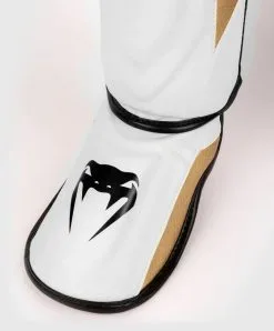 Venum Elite Evo Shinguards - White/Gold -Training gear shop Venum20Elite20Evo20sC3A4C3A4risuojat20valkoinen kulta207